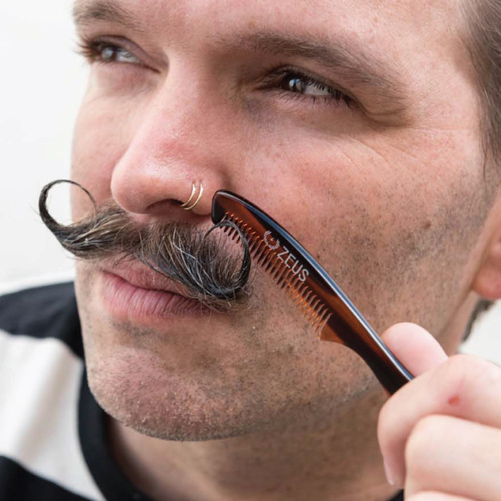 Model using long mustache comb