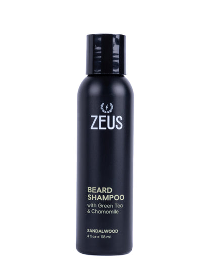 A matte black bottle of Zeus Beard Shampoo with Green Tea & Chamomile, featuring white and gold text on a clean white background.