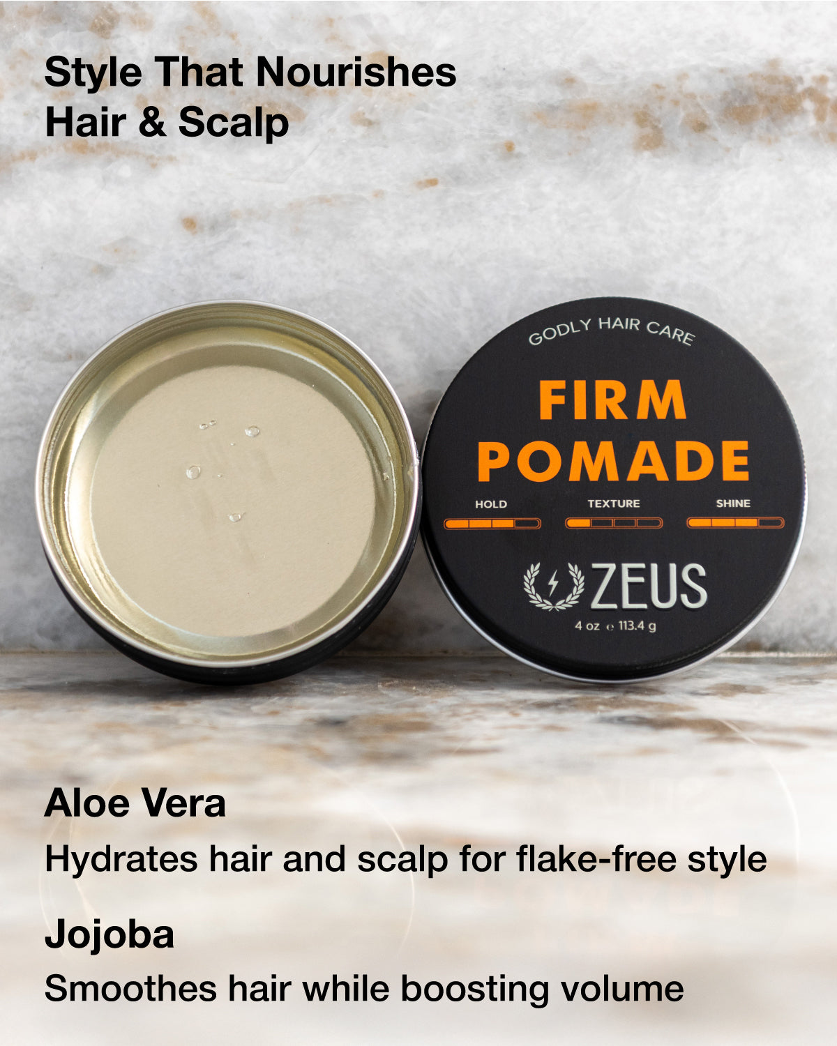 Zeus Firm Pomade container with open lid on a textured surface