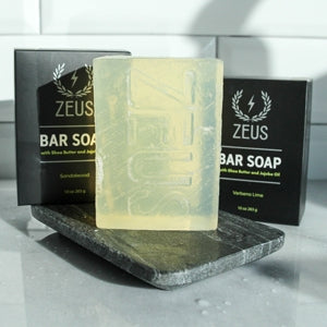 Zeus Bar Soap placed on tray with packaging