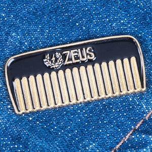 Zeus Comb Enamel Pin on denim